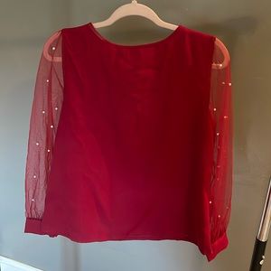Maroon long sleeve blouse with pearl detail. Medium.